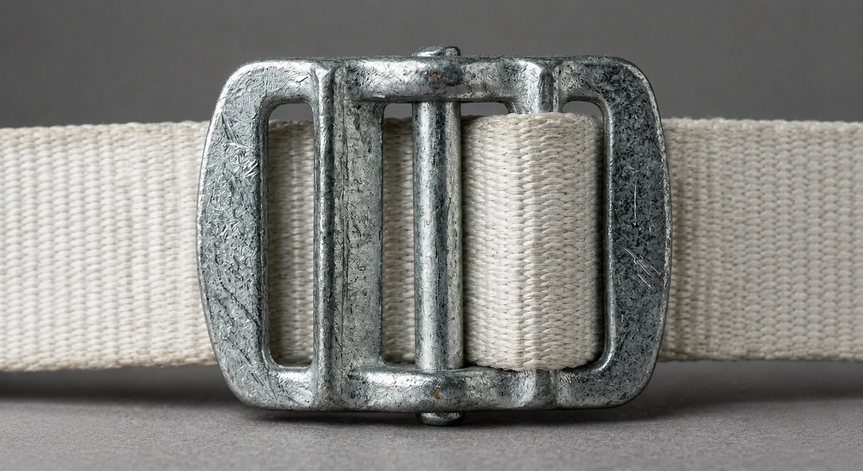Correctly threaded GI wire buckle holding cord strap tension — Greenstrix